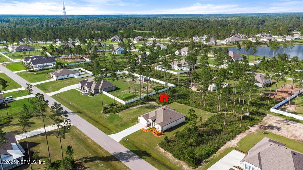 36012 Pitch Lane Hilliard, FL 32046 - Photo 47 of 54 an aerial view of residential houses with outdoor space