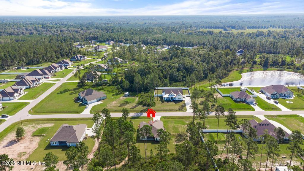36012 Pitch Lane Hilliard, FL 32046 - Photo 49 of 54 an aerial view of residential houses with outdoor space and river