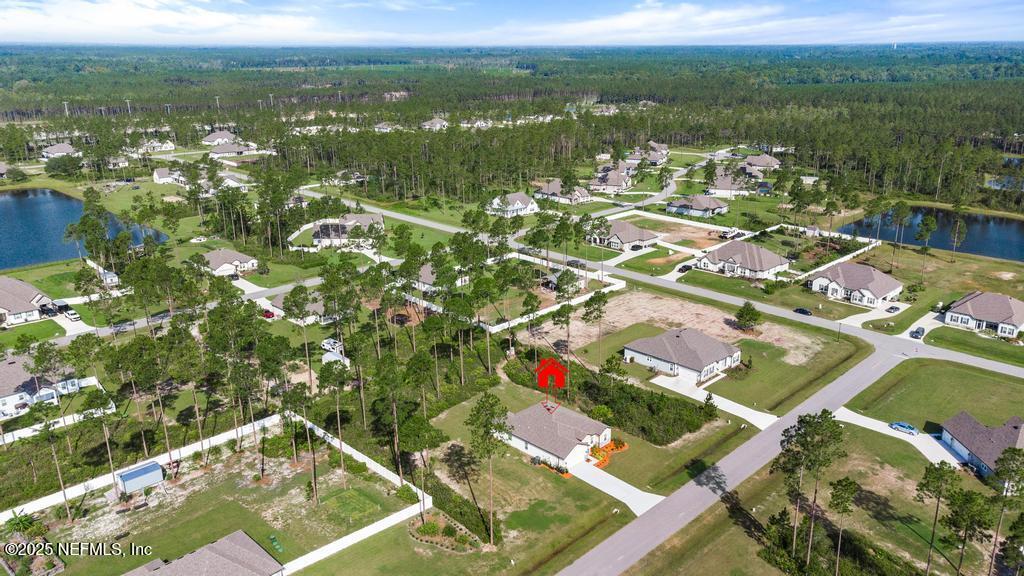 36012 Pitch Lane Hilliard, FL 32046 - Photo 51 of 54 an aerial view of residential houses with outdoor space
