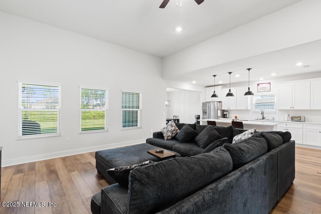 36012 Pitch Lane Hilliard, FL 32046 - Photo 8 of 54 a living room with furniture and a window