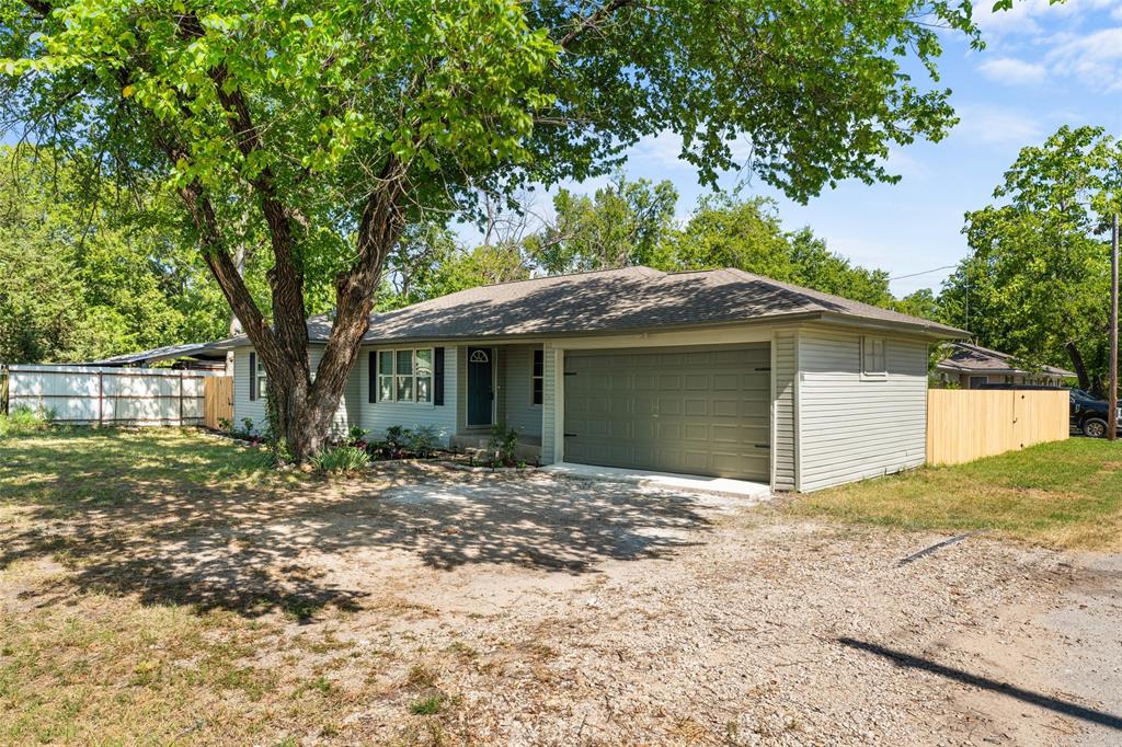 612 East 8th Street Kemp, TX 75143 - Photo 23 of 25 Single-story residence featuring light gray siding and a dark gray shingle roof
