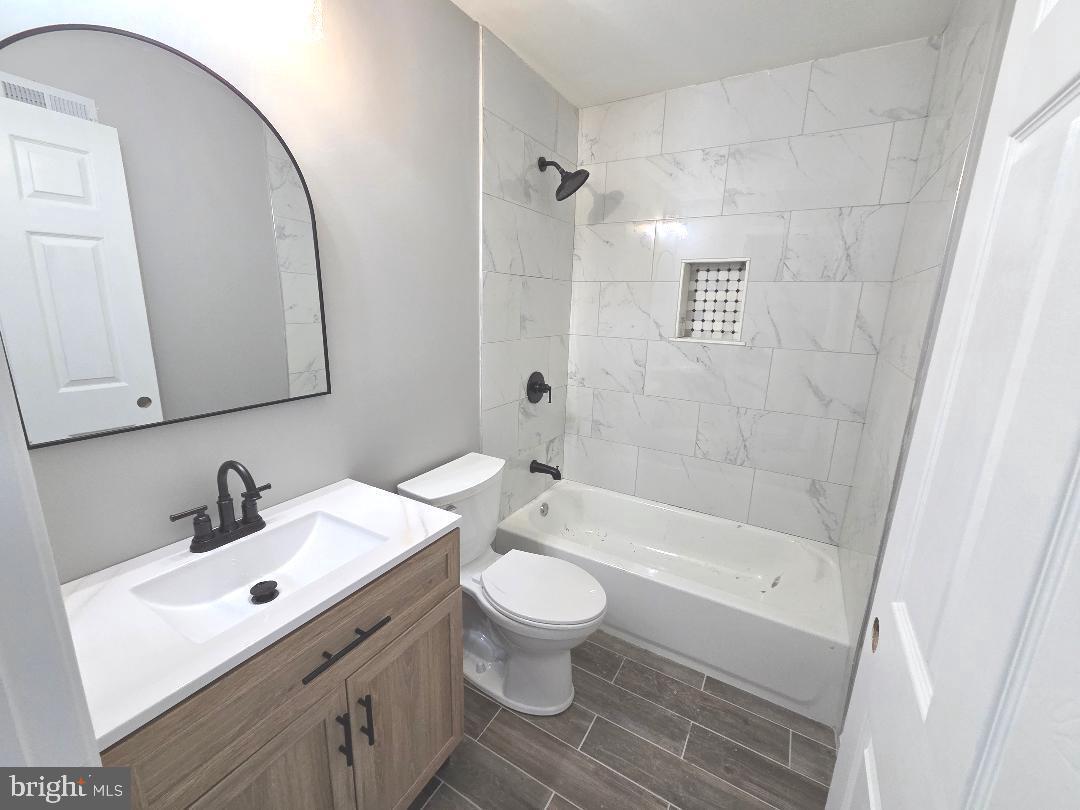 730 Excelsior Avenue Croydon, PA 19021 - Photo 7 of 10 a bathroom with a sink a toilet and a mirror