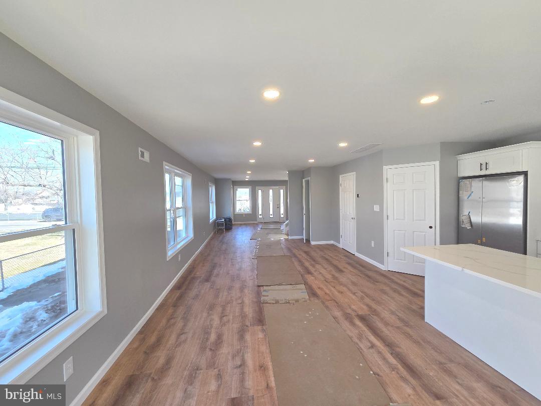 730 Excelsior Avenue Croydon, PA 19021 - Photo 8 of 10 a view of hallway with a large window and wooden floor
