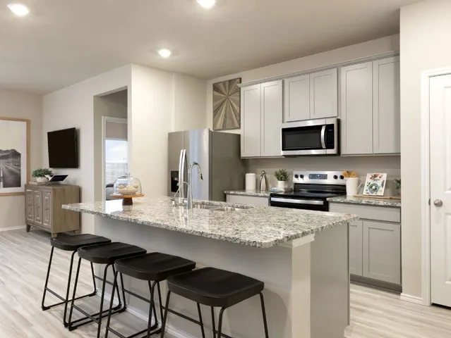 a picture of a wall with a white building and a shower