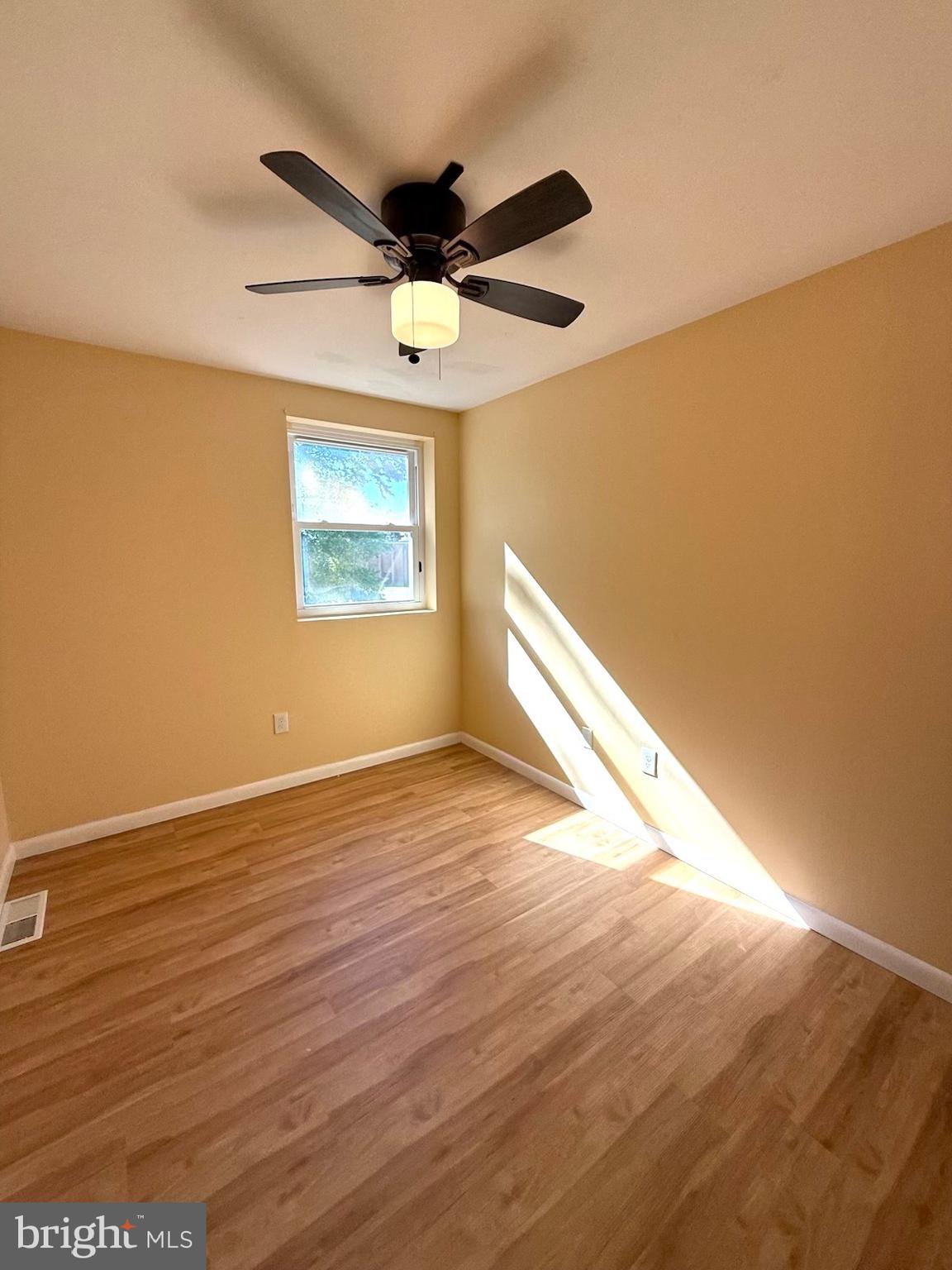 3608 Nanton Place Philadelphia, PA 19154 - Photo 35 of 64 an empty room with wooden floor fan and windows