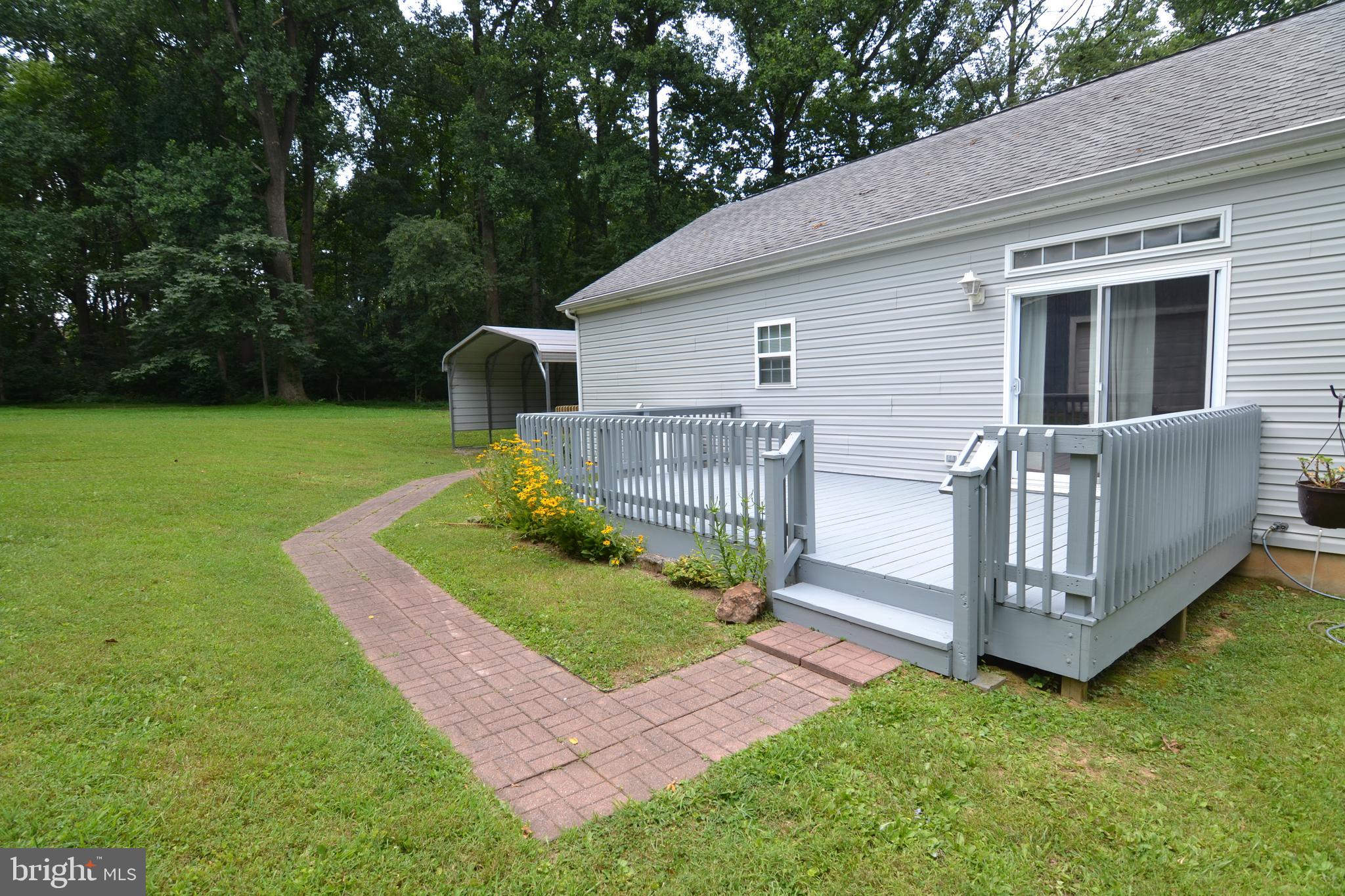 2061 Limestone Road Cochranville, PA 19330 - Photo 3 of 35 Rear deck with walk way to driveway