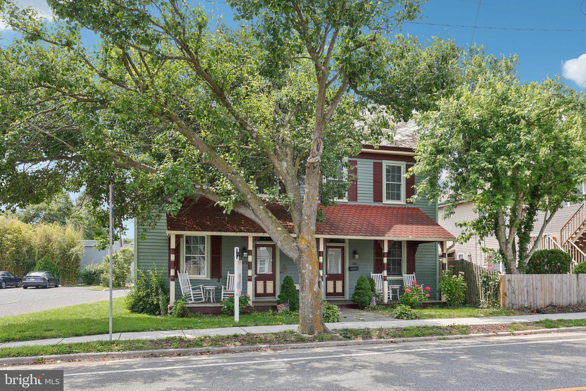416 Broadway Cape May, NJ 08204 - Photo 12 of 49 a front view of a house with a garden