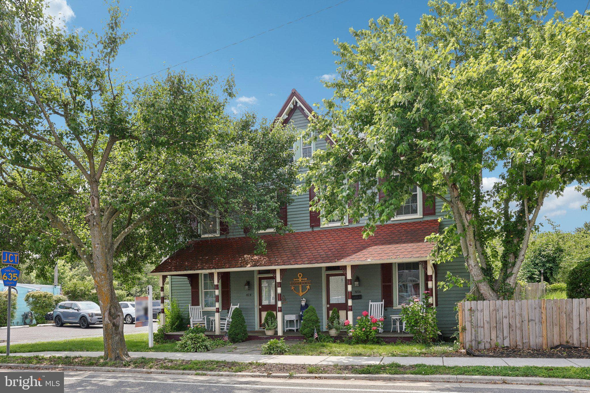 416 Broadway Cape May, NJ 08204 - Photo 14 of 49 a front view of a house with a yard