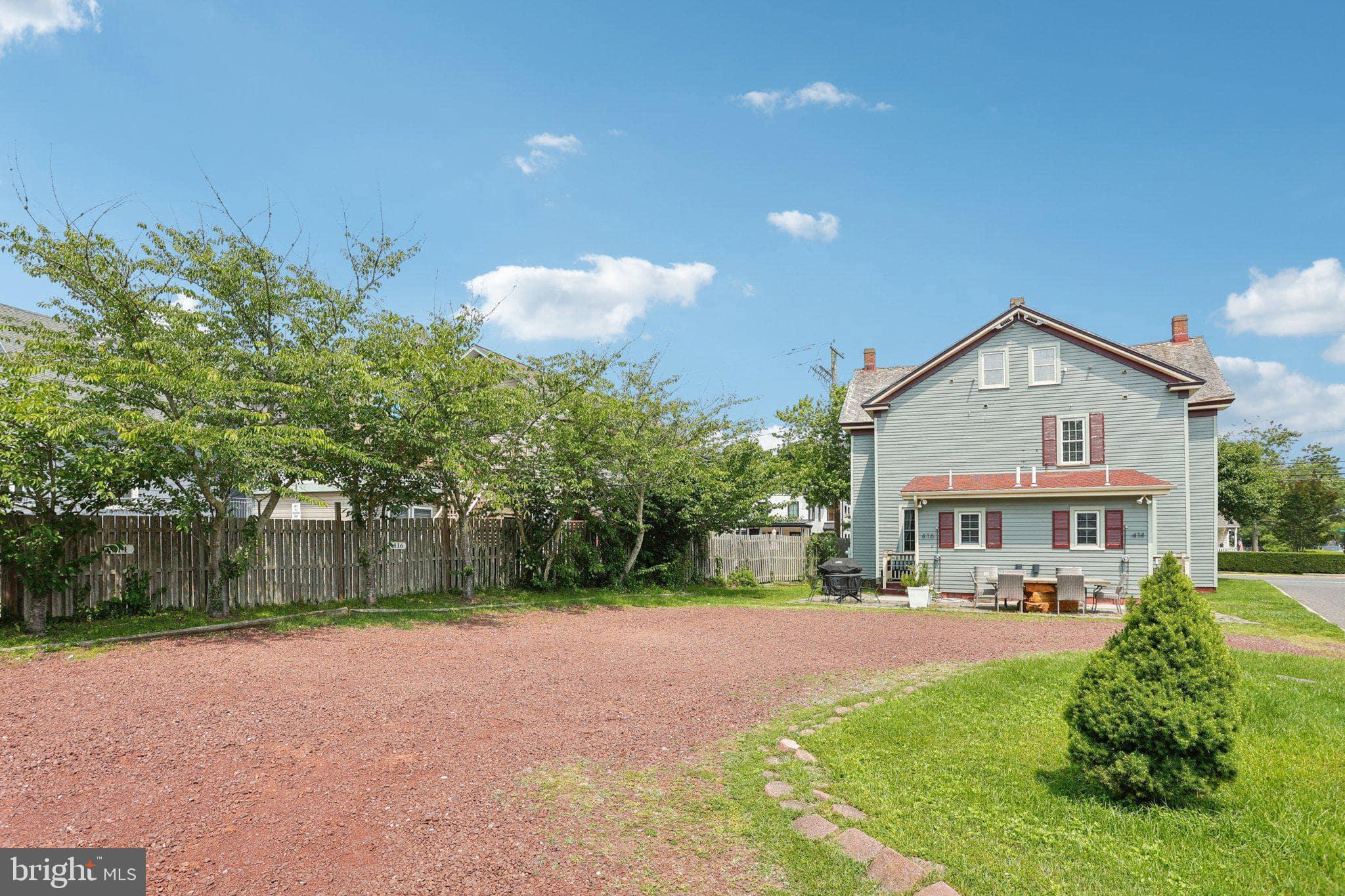 416 Broadway Cape May, NJ 08204 - Photo 18 of 49 a view of a big house with a yard and plants