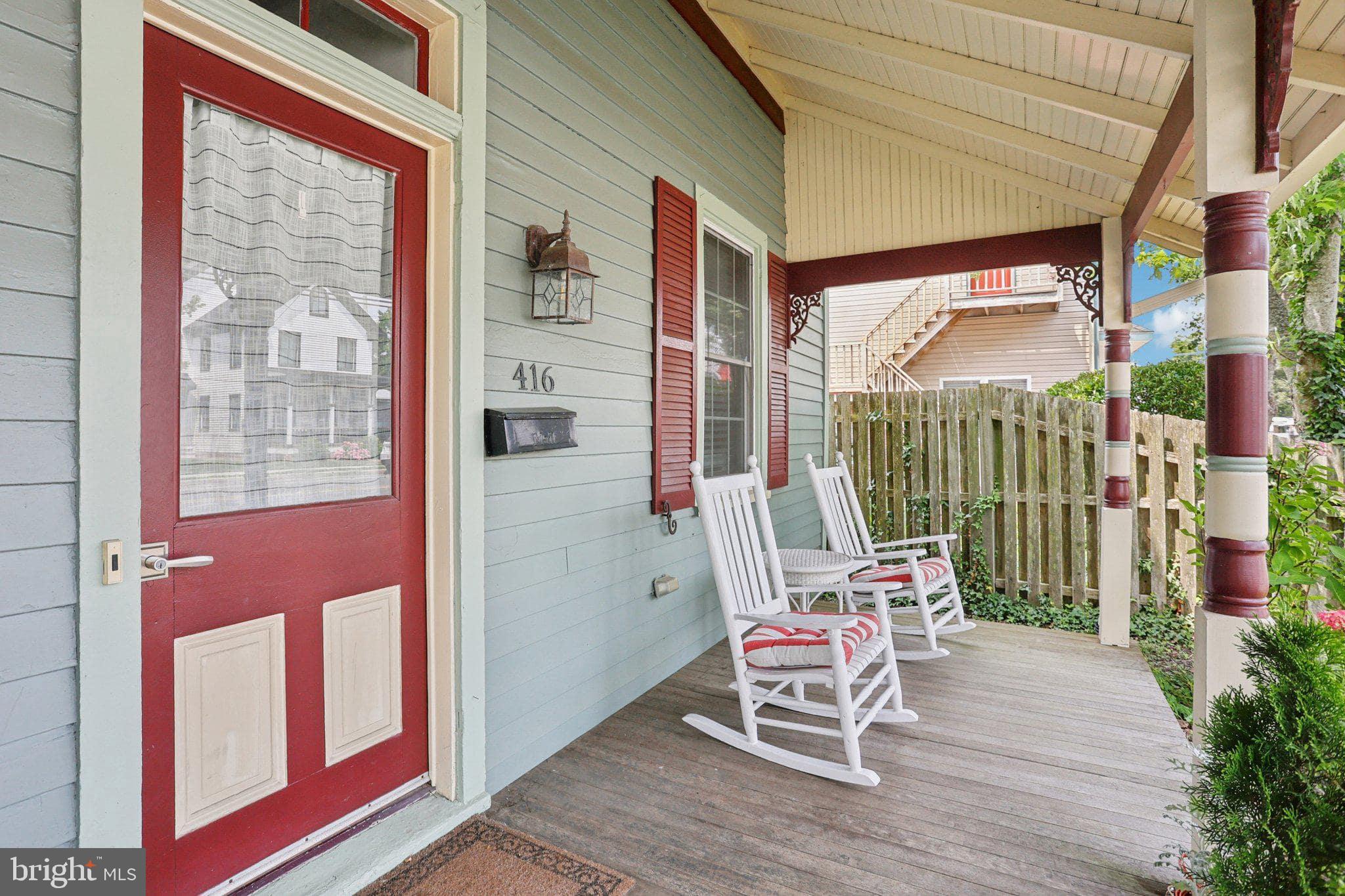 416 Broadway Cape May, NJ 08204 - Photo 24 of 49 a bench sitting in front of a building