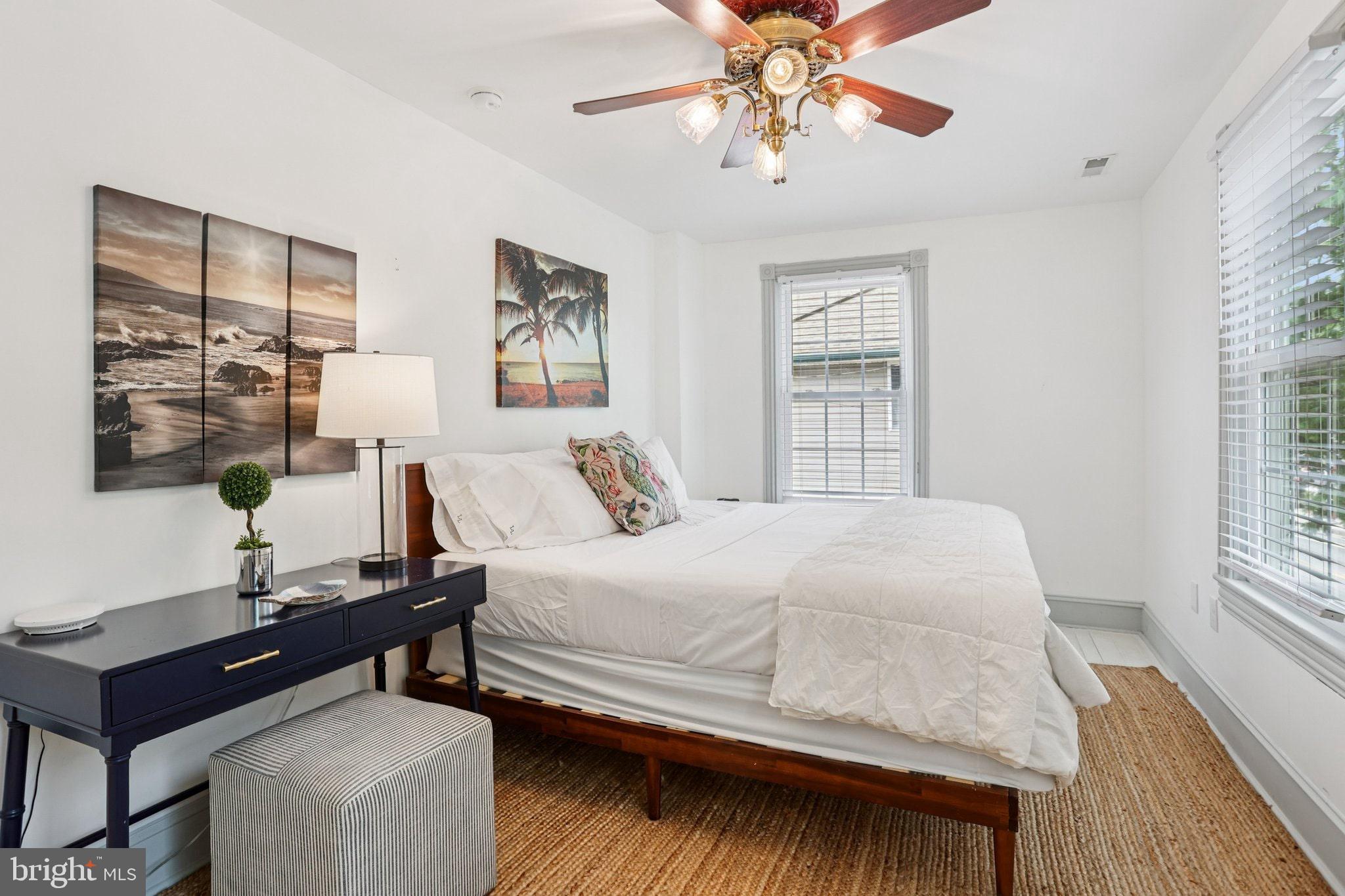 416 Broadway Cape May, NJ 08204 - Photo 42 of 49 a bedroom with a bed and a desk