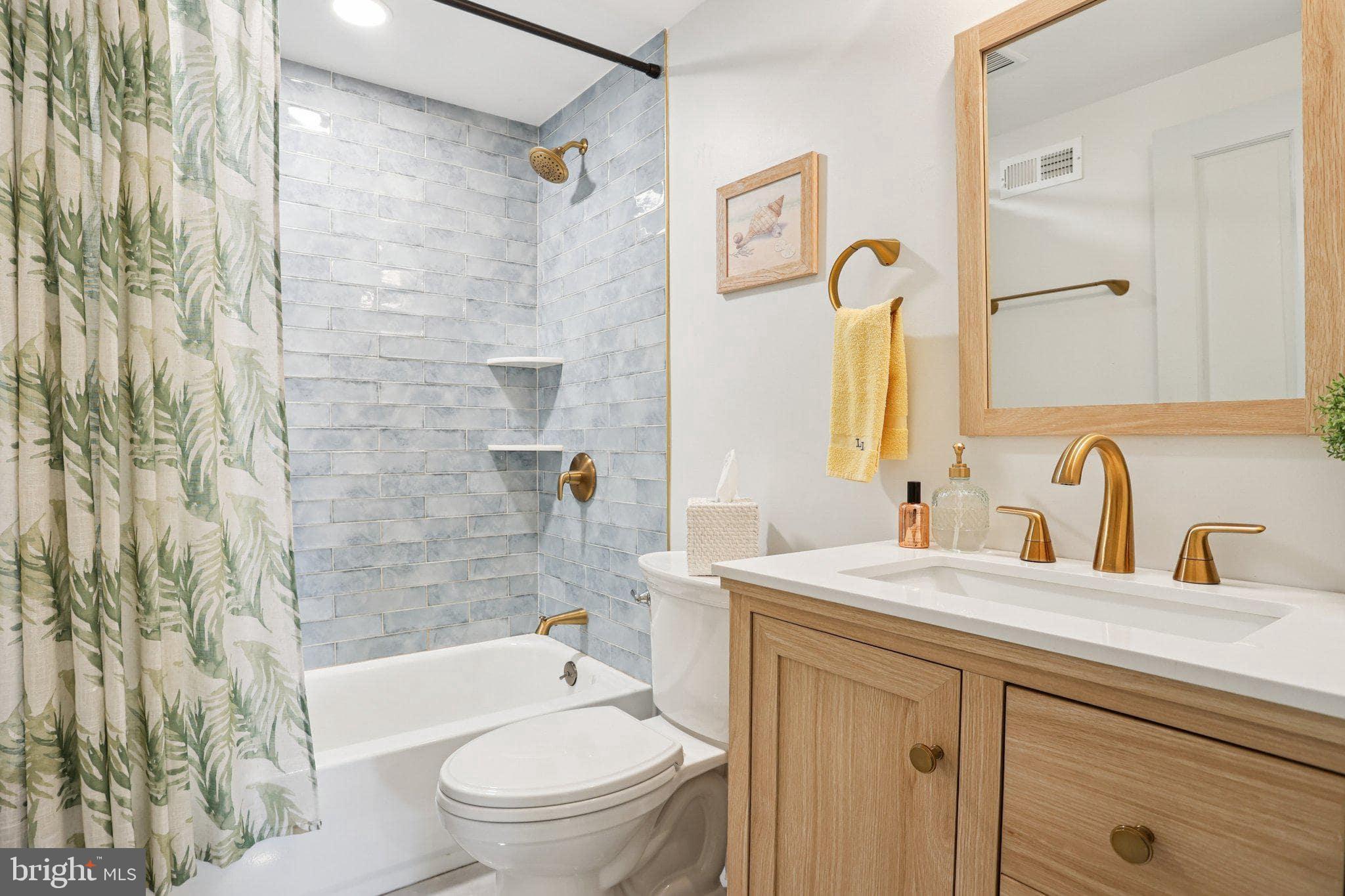 416 Broadway Cape May, NJ 08204 - Photo 44 of 49 a bathroom with a sink a toilet and a bathtub