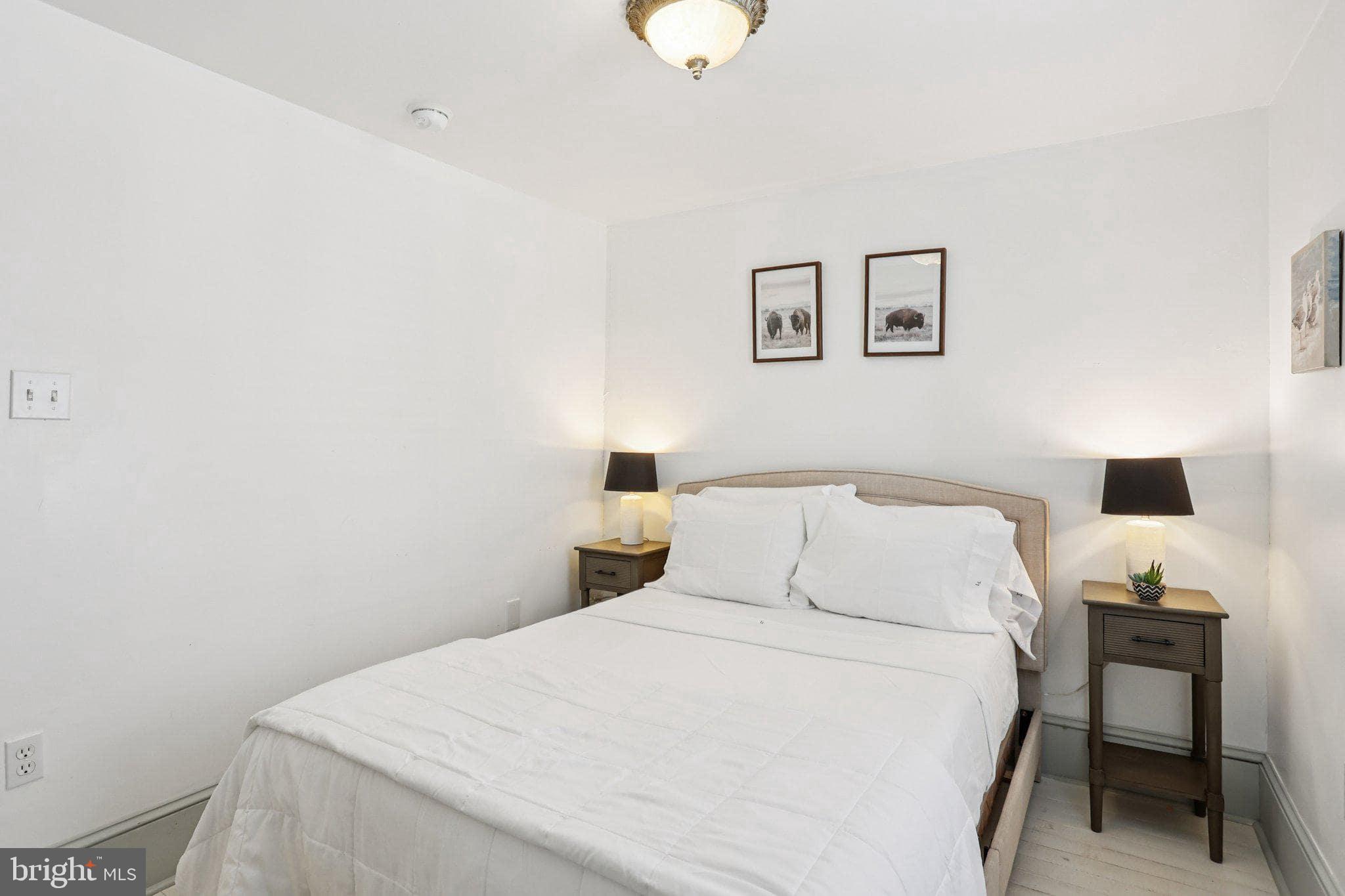 416 Broadway Cape May, NJ 08204 - Photo 46 of 49 a bedroom with a bed and a desk