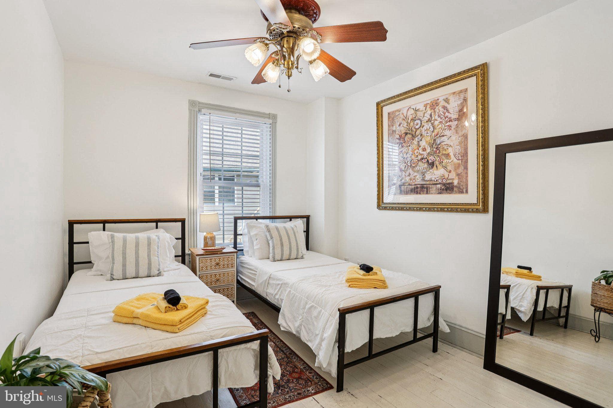 416 Broadway Cape May, NJ 08204 - Photo 48 of 49 a bedroom with furniture and a window