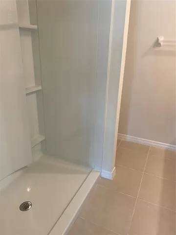 a view of an empty room and a window