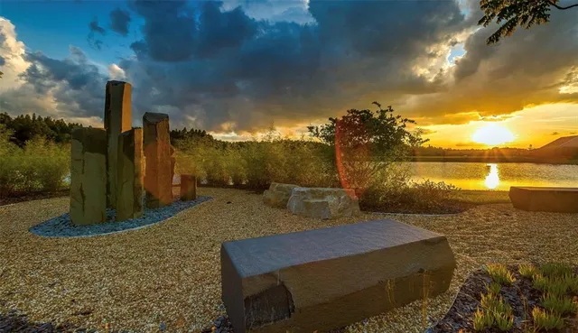 a view of a lake with a house in the background