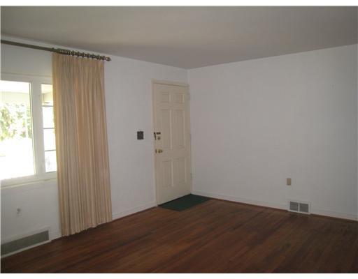 Living Room. Hall off living room leads to full bath and 2 bedrooms