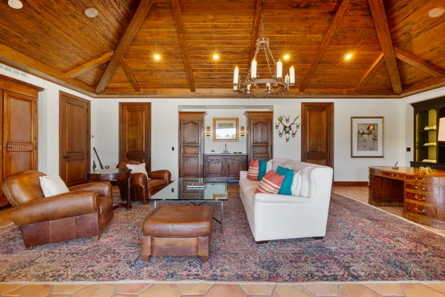 an aerial view of a houses with a lake view