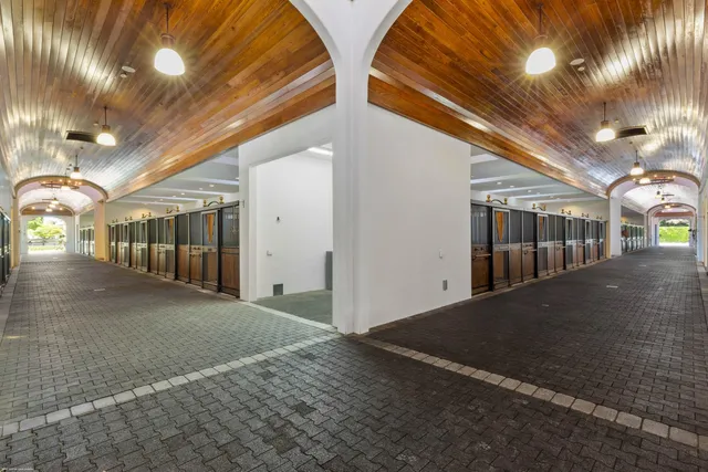 a large kitchen with a table and chairs