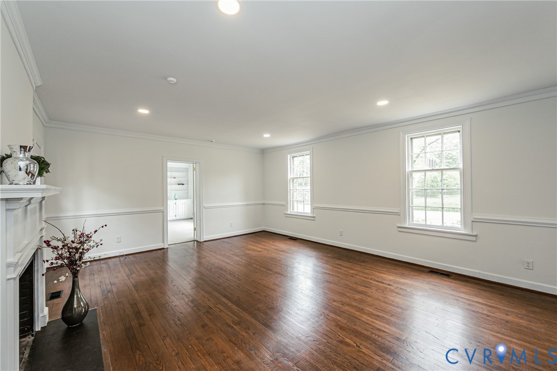 401 Caroline Street Ashland, VA 23005 - Photo 22 of 63 an empty room with wooden floor and a window