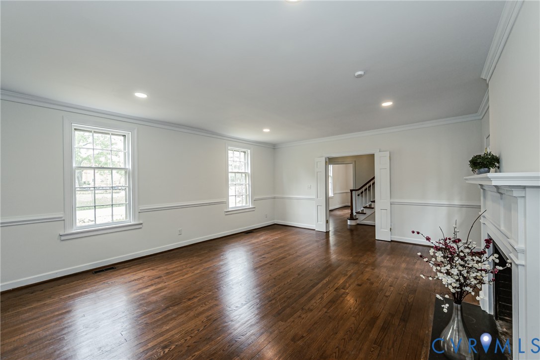 401 Caroline Street Ashland, VA 23005 - Photo 24 of 63 an empty room with wooden floor and windows