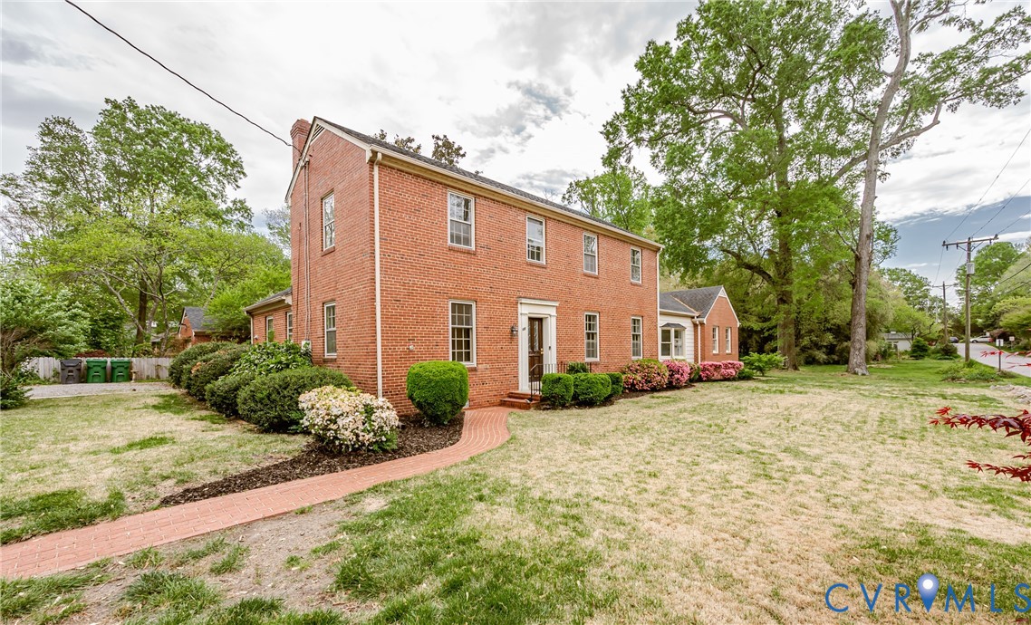 401 Caroline Street Ashland, VA 23005 - Photo 3 of 63 The property features a brick exterior, a walkway