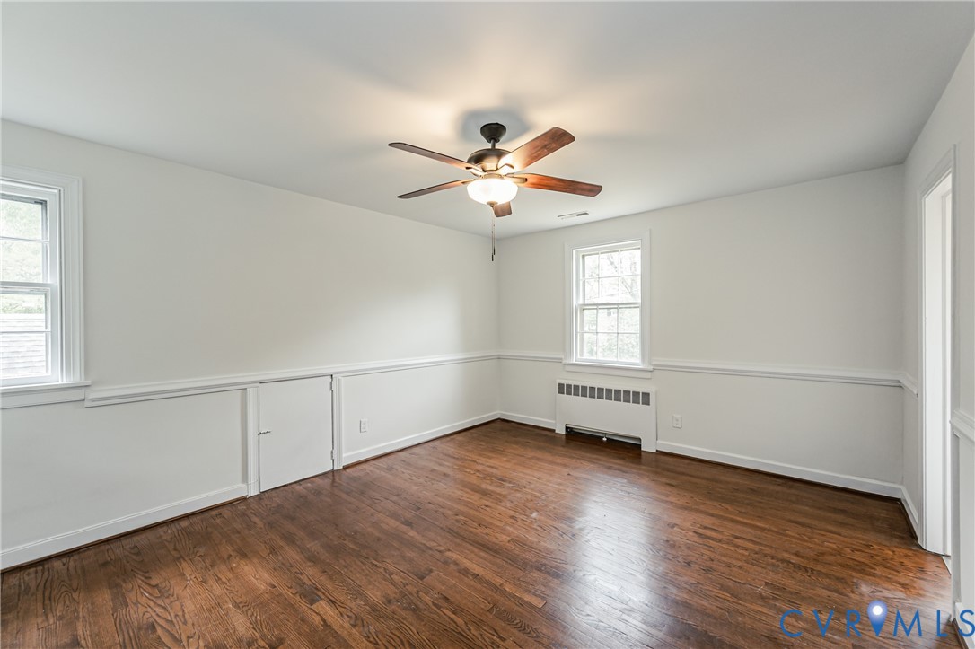 401 Caroline Street Ashland, VA 23005 - Photo 38 of 63 an empty room with wooden floor and windows
