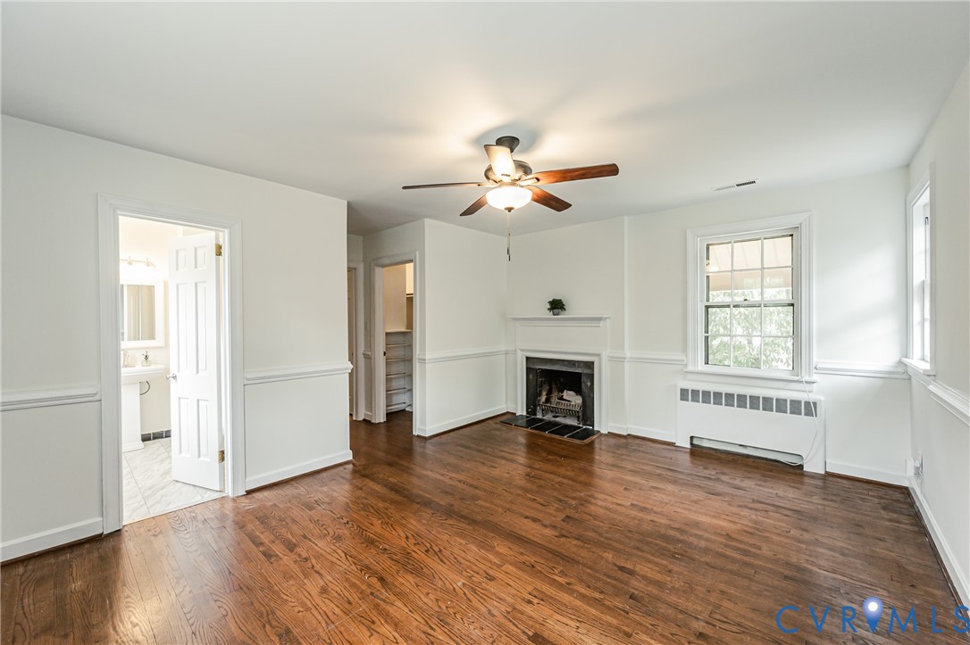 401 Caroline Street Ashland, VA 23005 - Photo 40 of 63 an empty room with wooden floor fan and windows