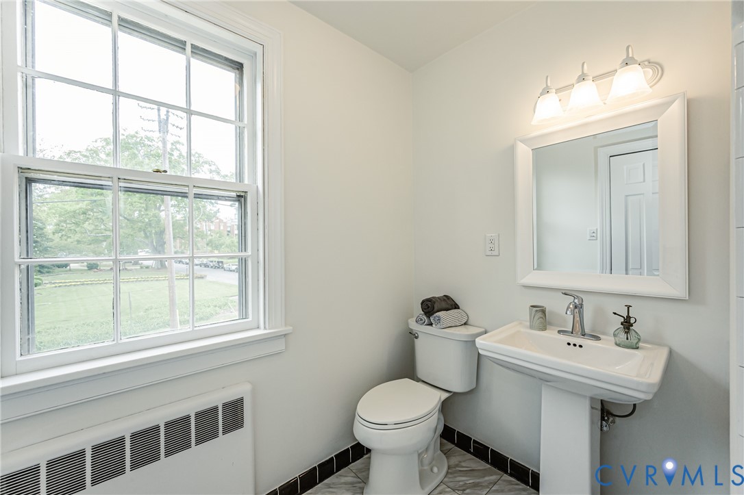 401 Caroline Street Ashland, VA 23005 - Photo 43 of 63 a bathroom with a sink and a toilet