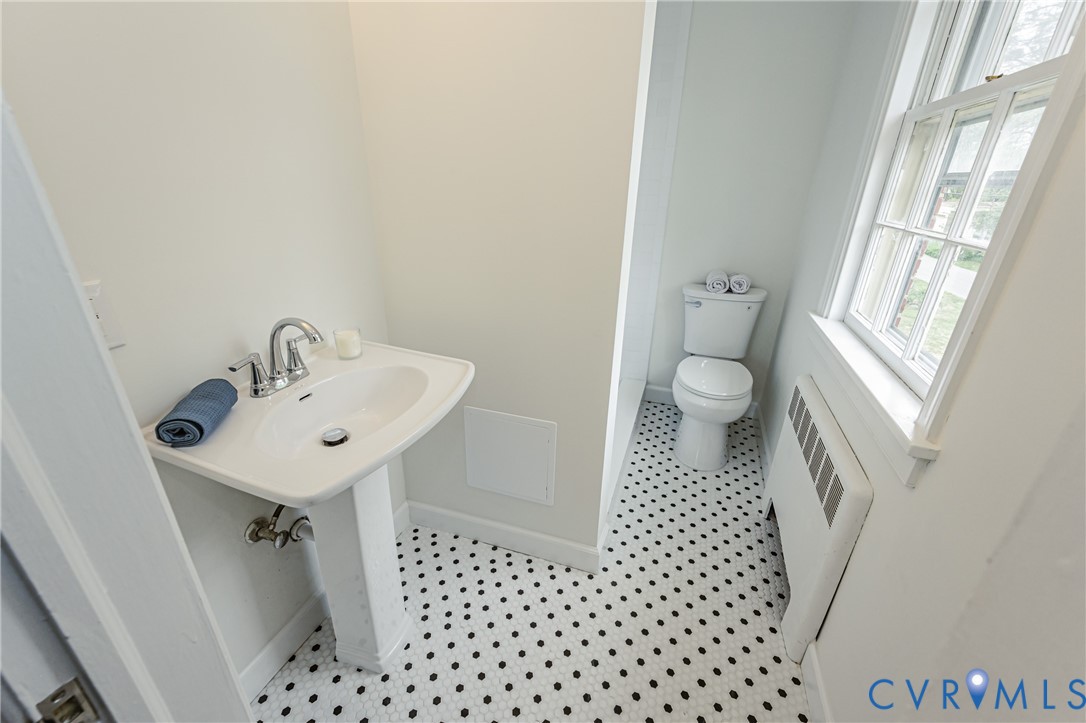 401 Caroline Street Ashland, VA 23005 - Photo 47 of 63 a bathroom with a sink a toilet and a shower