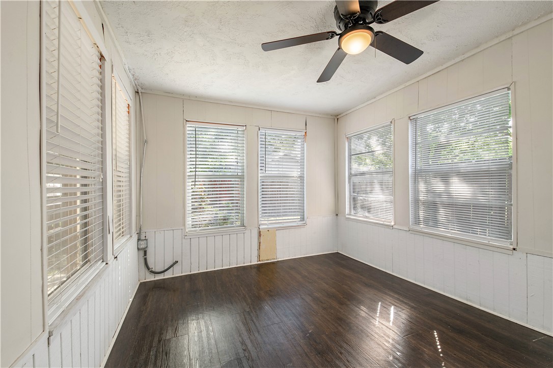 4403 Robinhood Circle Bryan, TX 77803 - Photo 15 of 19 a view of an empty room with wooden floor and a window