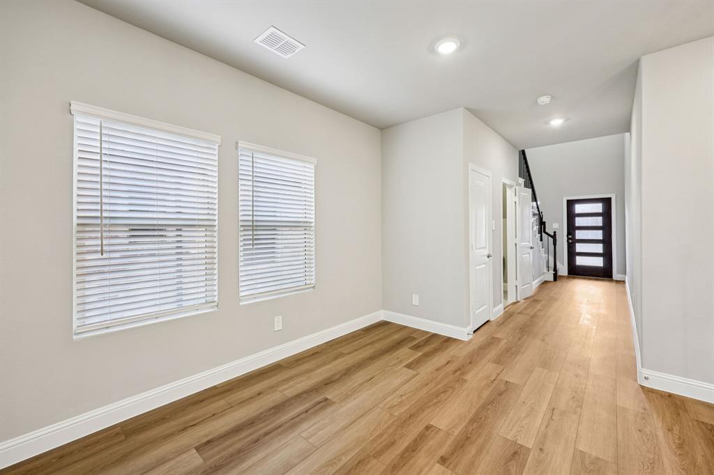 1721 Arches Road Anna, TX 75409 - Photo 5 of 39 a view of empty room with wooden floor and fan