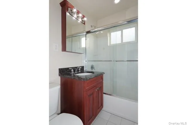 a kitchen with stainless steel appliances granite countertop a sink and a stove