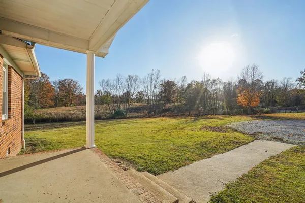 a kitchen with stainless steel appliances granite countertop a sink a stove and cabinets
