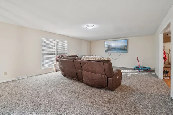 a bedroom with bed and a window