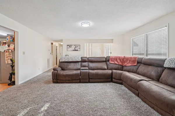 a spacious bathroom with a double vanity sink mirror and toilet