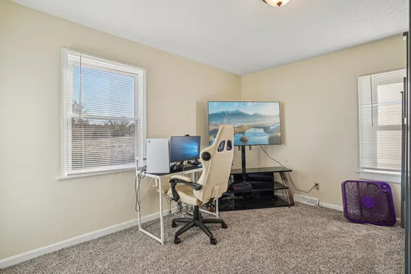 a kitchen with stainless steel appliances dining table and chairs