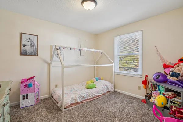 a view of a yard with wooden fence