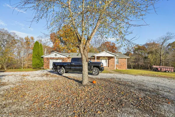 a kitchen with stainless steel appliances granite countertop a sink stove and wooden cabinets