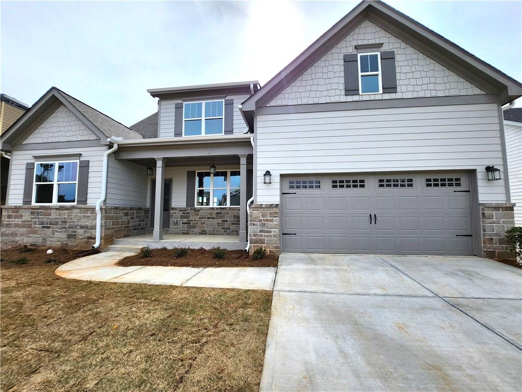 a front view of a house with garage