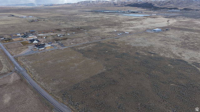 1065 Goshen Canyon Road, Unit 2 Mona, UT 84645 - Photo 16 of 21 Aerial view of property and surrounding area featuring a mountainous background and rural landscape