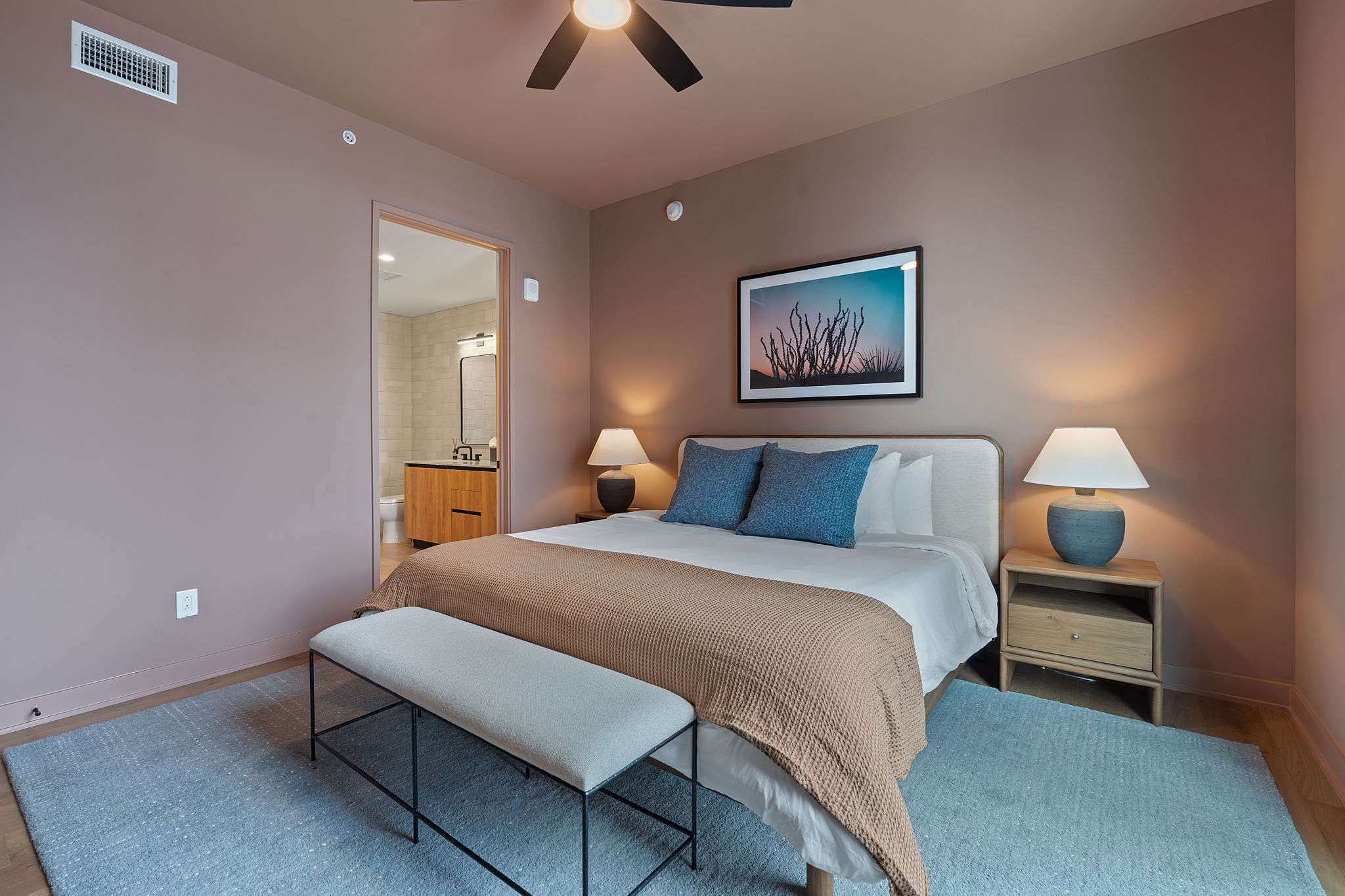 84 East Avenue, Unit 1801 Austin, TX 78701 - Photo 7 of 28 Representative Photo. Primary Bedroom with wood flooring, large window, ceiling fan, and window treatments included