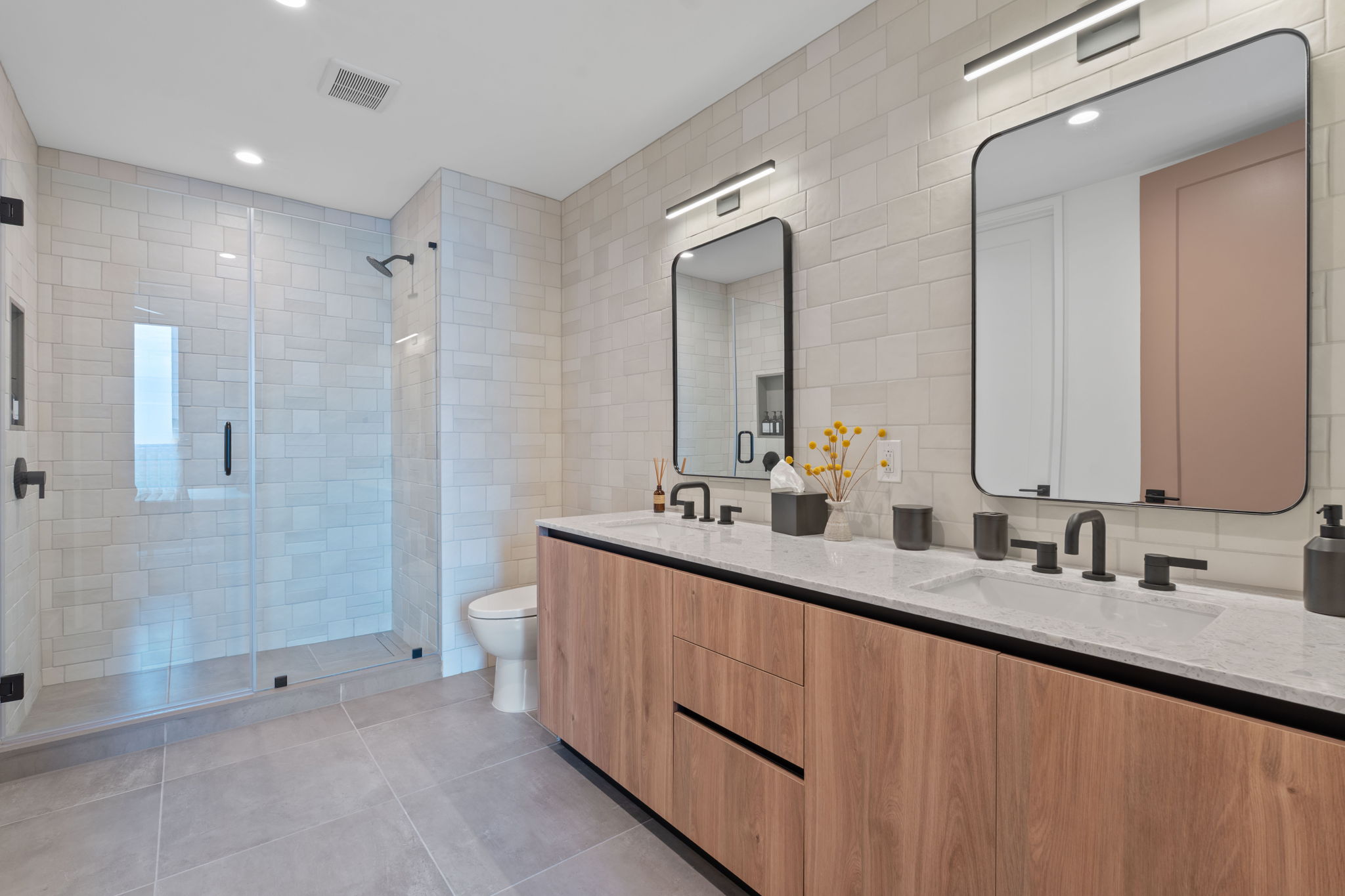 84 East Avenue, Unit 1801 Austin, TX 78701 - Photo 9 of 28 Representative Photo. Primary Bath with spacious double vanity, floor to ceiling tile, and a walk in shower