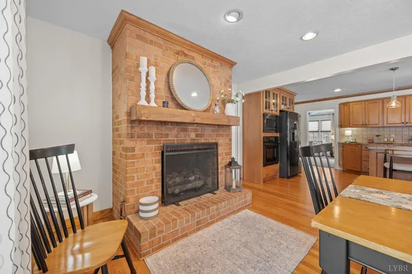 a kitchen with a sink cabinets and wooden floor