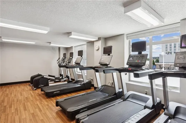 a room with gym equipment and a large window