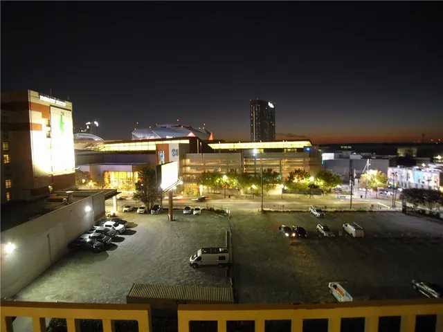 a large kitchen with a large counter top appliances and cabinets