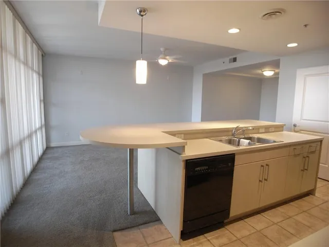 a large kitchen with a large window