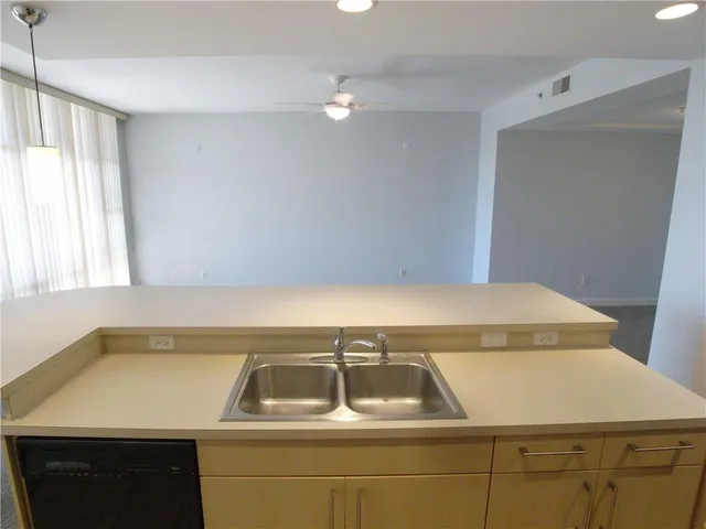 a kitchen that has a sink and a stove