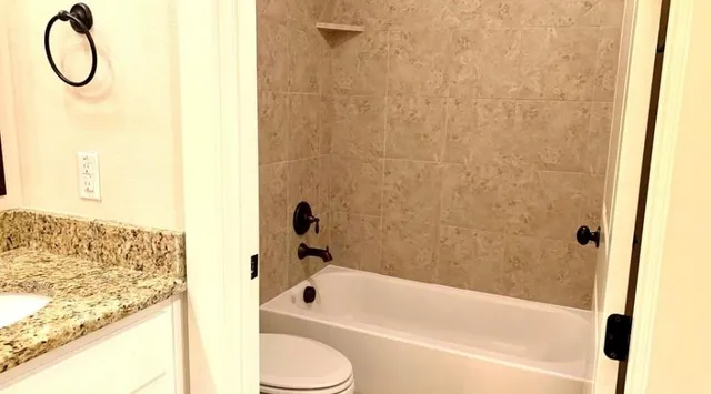 a bathroom with a bath tub and a shower curtain