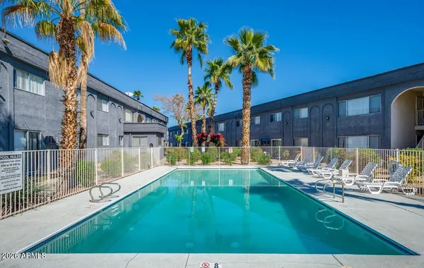 a view of an house with swimming pool outdoor seating